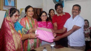 জিনারদীতে পূজামন্ডপে অর্থ ও পোশাক বিতরণ